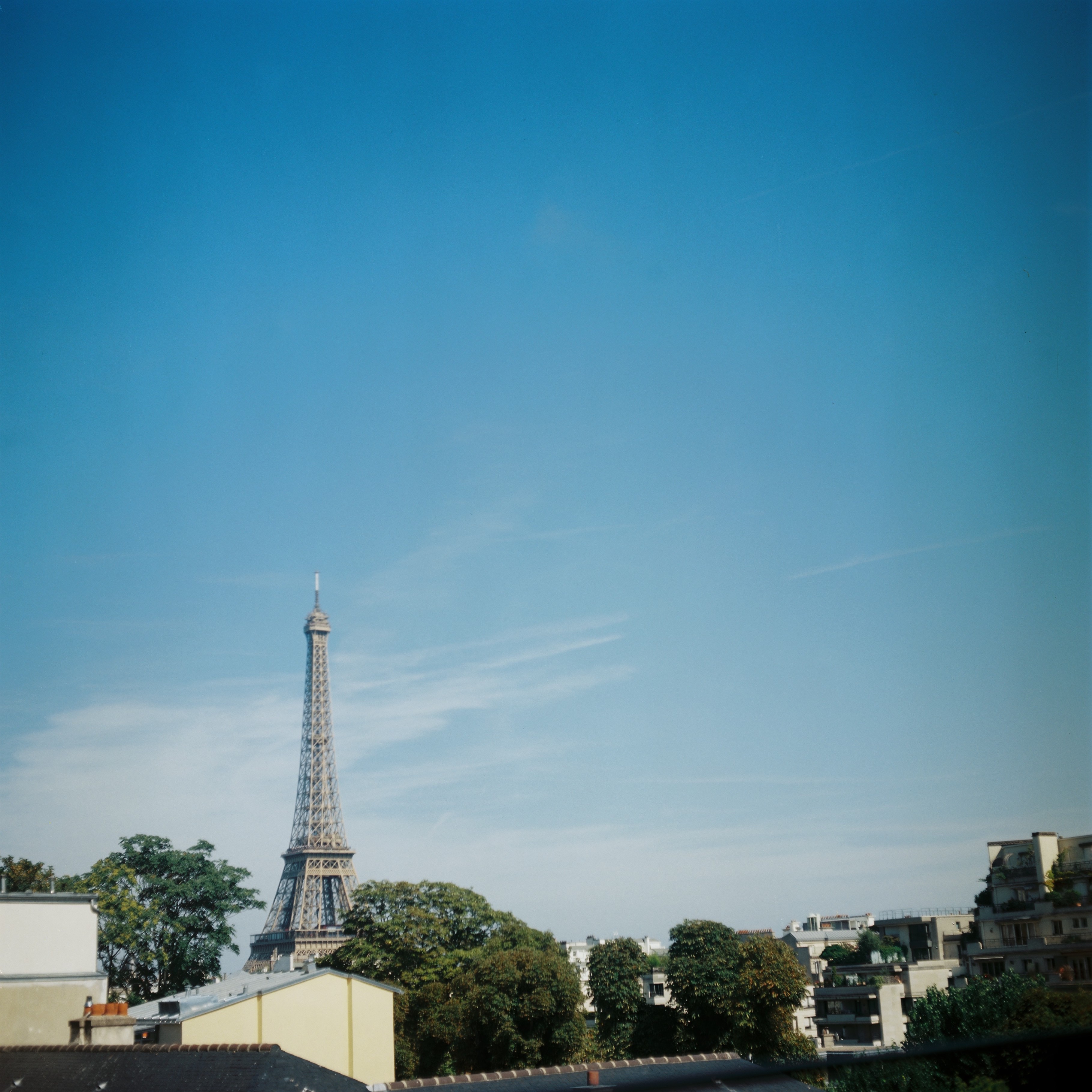 view of the eiffel tower from the gardens at the maison de balzac in the 16th arrondissement