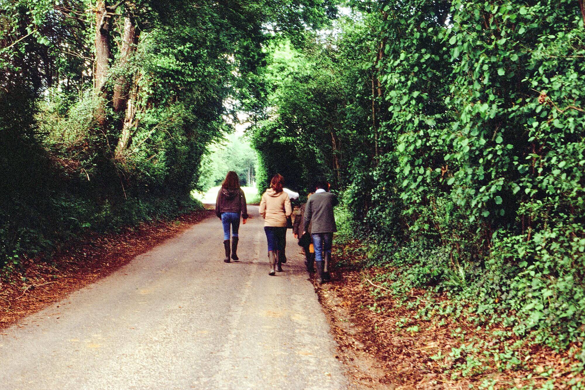 A family walk on a narrow country lane in the French countryside during the COVID 19 quarantine. 